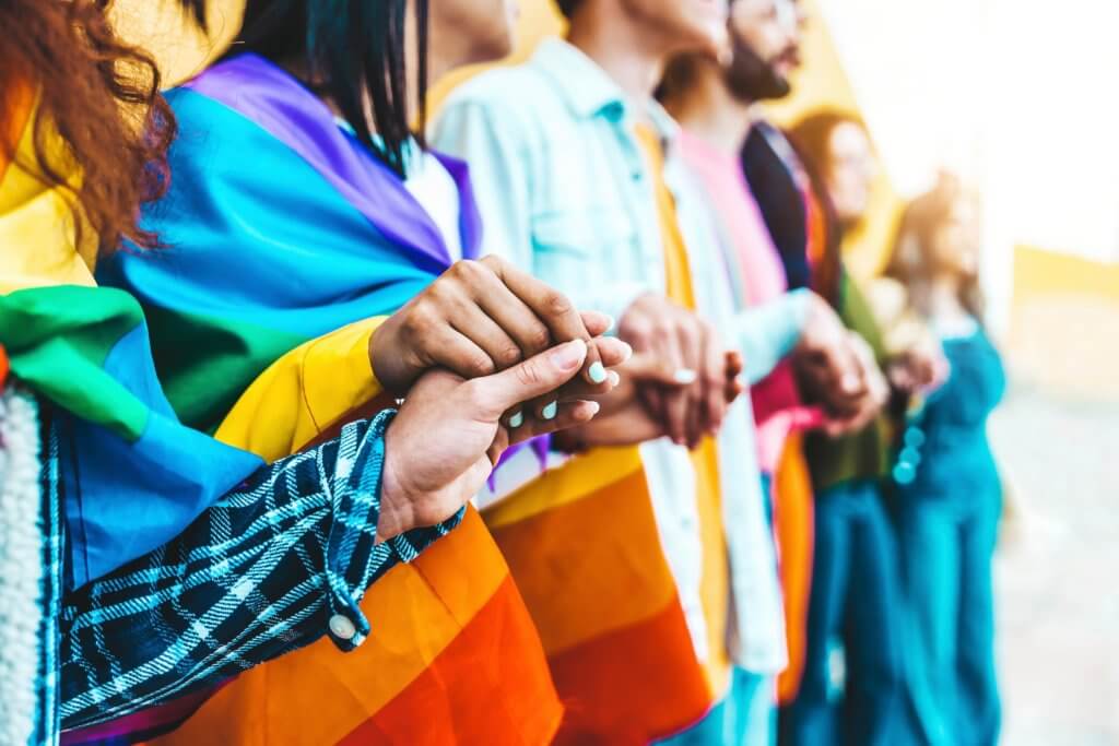 gay and lgbtq+ friends holding hands